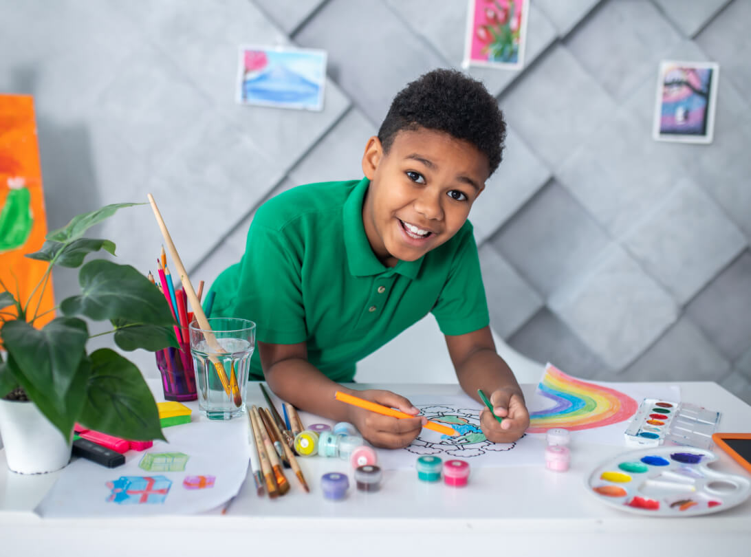 Child painting and doing art
